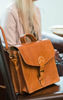 Light Brown Mini Marrakech Satchel Next to Person on Brown Chair